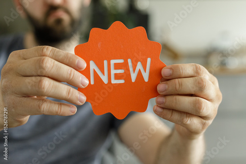 Close-up of a man holding a...