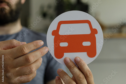 Image of a man holding a pa...