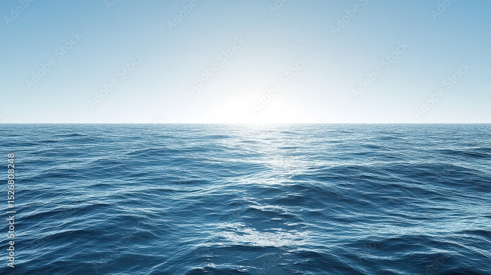 Fototapeta premium A stunning panoramic view of the ocean with gentle waves under a clear blue sky, capturing the serene beauty of nature and the vastness of the sea.