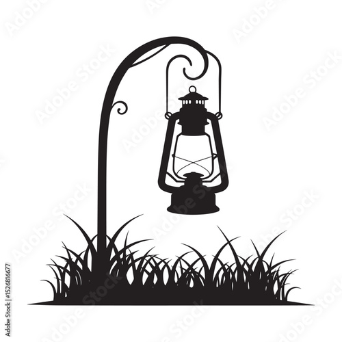 A black silhouette of an antique oil lantern hanging from a curved post amidst tall grass, isolated on a white background. Silhouette of an oil lantern hanging in grass isolated on white background