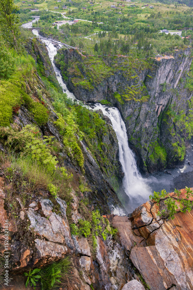 Majestic waterfall of Vøringfossen in a foggy day (Norway) Majestic waterfall of Vøringfossen in a foggy day (Norway)