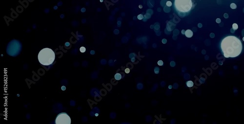 A seamless loop of abstract light particles moving gracefully through a dark, ethereal space. Soft, dreamy bokeh effect.
Ideal for background or overlay. 4K, slow motion, calming atmosphere.