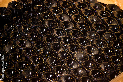 Wine bottles, stored upside down, waiting to be filled with wine at a South African cellar in the cape winelands.