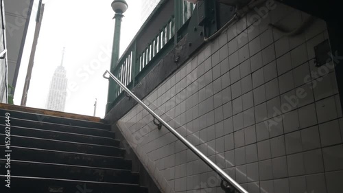 New York City underground subway globe, metro orb lamp. Empire State building. Metropolitan entrance stairway, Manhattan, 34 st. Midtown financial business district. Public transport station stairs.