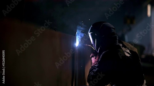 Welding Process in Industrial Setting is characterized by intense Sparks and Smoke