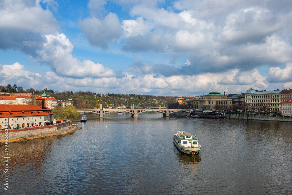 Fototapeta premium Picturesque view of the Vltava River in the center of the capital of the Czech Republic, Prague, on a spring day