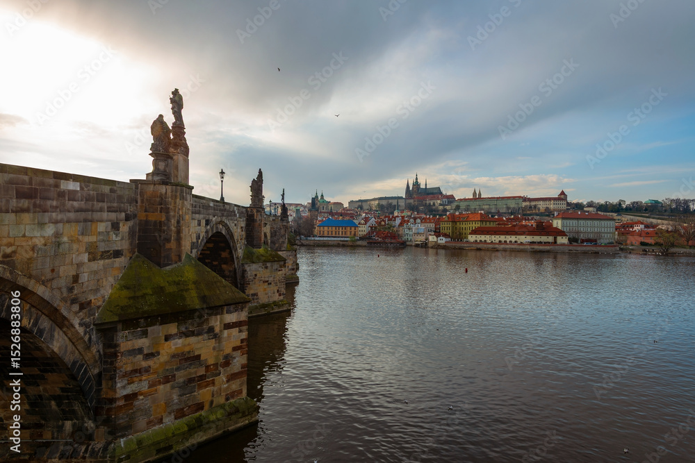 Obraz premium The Vltava River in the center of the Prague, Czech Republic, on a cloudy spring day