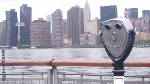 New York City waterfront skyline, Manhattan Midtown buildings, riverfront skyscrapers by East river. Waterside cityscape, tower viewer, Gantry Plaza. Long Island, Queens. United States tourism. Rainy.