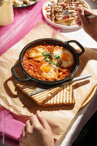 Menemen in Ceramic Pot with Bread Slices