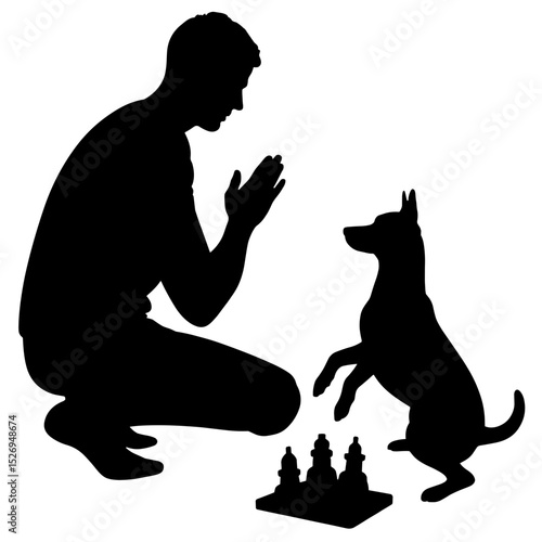 Silhouette of owner clapping as dog solves toy puzzle, positive reinforcement training