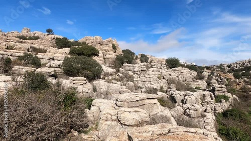Hiking in the Torcal de Antequerra National Park, limestone rock formations and known for unusual karst landforms in Andalusia, Malaga, Spain.