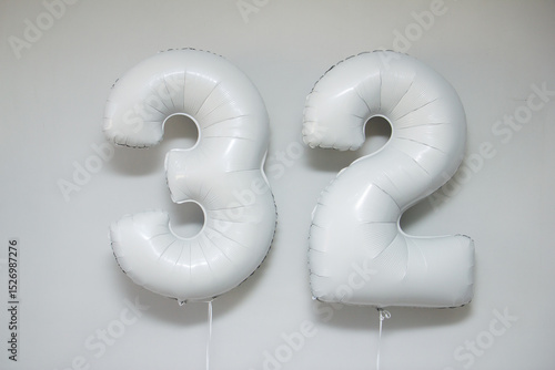 white foil numbers 32 with helium