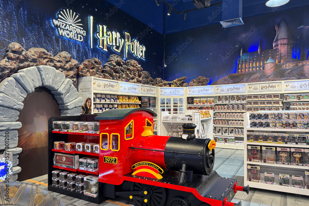 Fototapeta premium May 18, 2025, Dubai, UAE: Harry Potter-themed section inside Hamleys toy store in Dubai, filled with plush toys, collectibles, wizard decor. Magical retail experience for fans