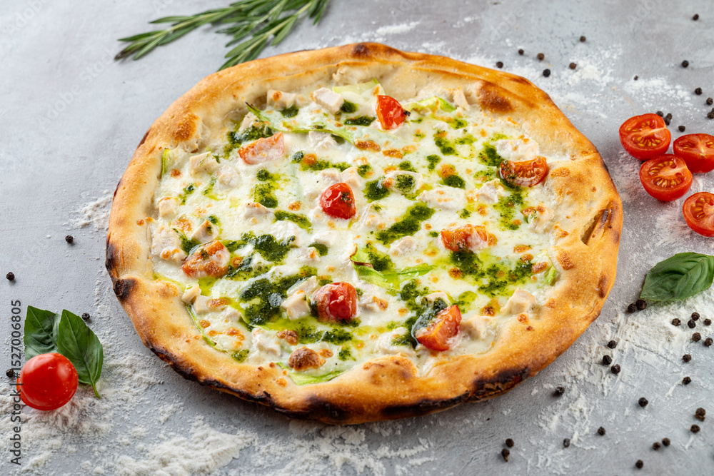 A delicious pizza rests on a textured surface, artfully topped with melted cheese, cherry tomatoes, fresh herbs, and vibrant green pesto. The inviting aroma beckons pizza lovers A delicious pizza rests on a textured surface, artfully topped with melted cheese, cherry tomatoes, fresh herbs, and vibrant green pesto. The inviting aroma beckons pizza lovers