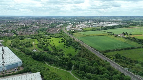 Wallpaper Mural Aerial drone shot of train moving along railway line surrounded by rural landscape England UK sunny day Spring green transportation infrastructure  Torontodigital.ca