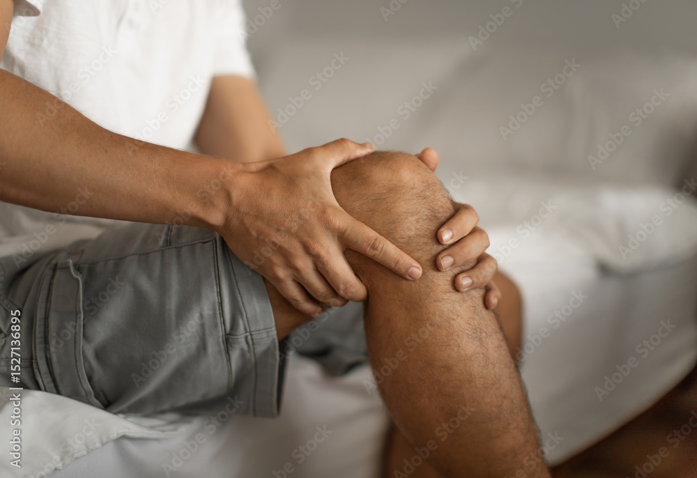 Fototapeta premium Closeup of person with sore knee joint, arthritis, injury concept 