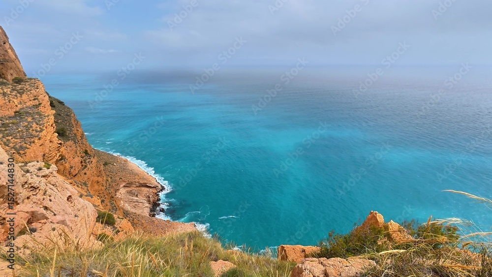 Fototapeta premium Experience breathtaking coastal views with turquoise waters and dramatic rocky cliffs