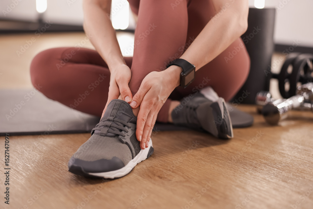 Sportswoman with leg injury in fitness studio, closeup Sportswoman with leg injury in fitness studio, closeup