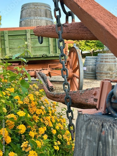 An old wooden wagon with its hitch clearly visible in the foreground sits in Rancho Cucamonga, California, emphasizing elements of early transportation.