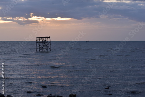 The sea and evening light with rain clouds,  sun and clouds, Evening sunset over the sea during the tropical monsoon rain season