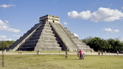 Visitors explore the iconic El Castillo pyramid at Chichen Itza, a World Heritage Site and ancient Mayan temple in Mexico.