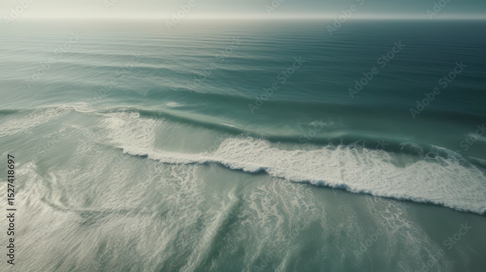 Obraz premium Tranquil Seascape Capturing the Gentle Waves and Vast Horizon of the Ocean Under a Serene Sky, Evoking Peace and Natural Beauty.