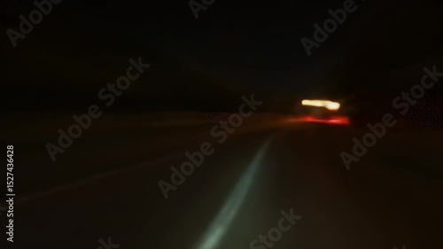 Abstract Motion Blur of Car Headlights at Night on Black Asphalt Road Surface in Dark Night Blurry Lights Speed and Vibrant Colors