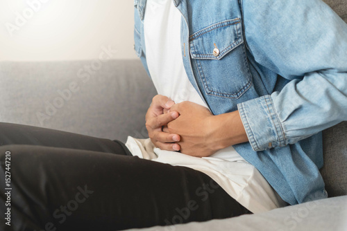 Papier peint Person feel stomach pain and have a stiff belly