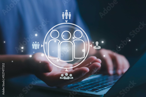 Obraz na plátně Businessmen use computers to recruit, manage and recruit HR teams to develop the leadership of employees and personnel for the company's competitive strategy to be successful