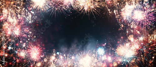 Wallpaper Mural A festive frame of fireworks exploding in the night sky with a dark background and colorful sparks Torontodigital.ca