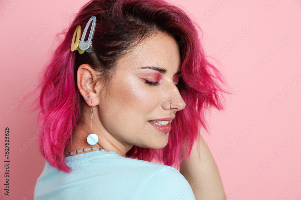 Fototapeta premium Beautiful woman with bright dyed hair on pink background