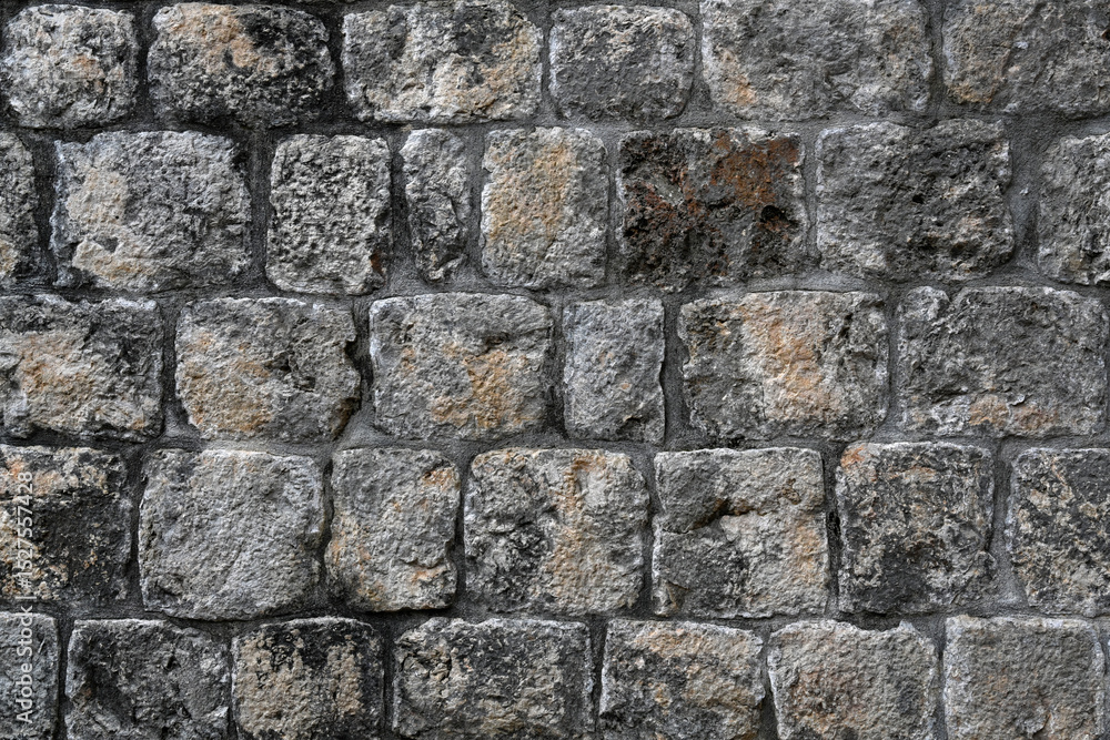 Fototapeta premium Background texture closeup of an old grey stone wall