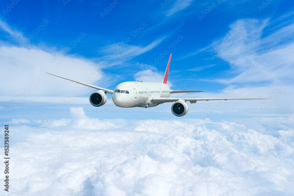 Obraz premium Airplane in the flight, travel background with airplane flying in the blue sky over the cloudscape. Flying airplane with blank livery
