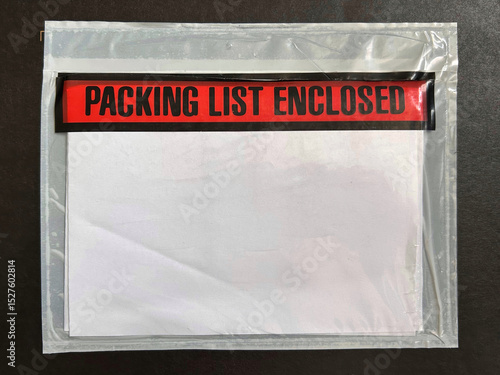 Transparent adhesive pouch containing documents with bold red label stating 