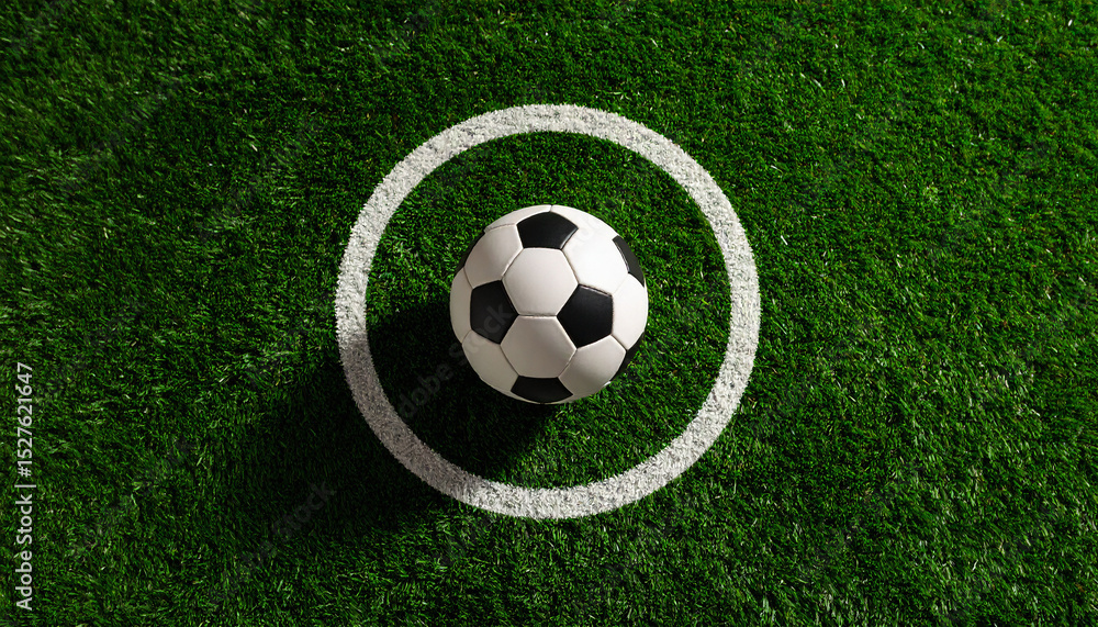 Fototapeta premium Football at Center Circle on Green Pitch