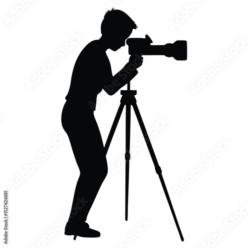 Black Silhouette of Photographer with Camera on Tripod Taking Shot