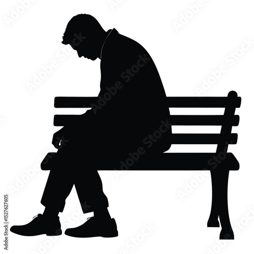 Silhouette of a Man Sitting on Park Bench with Head Down in Despair