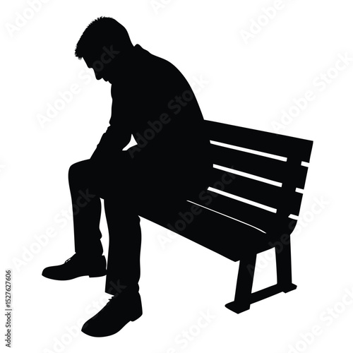 Silhouette of a Man Sitting on a Park Bench Looking Downward Sadly