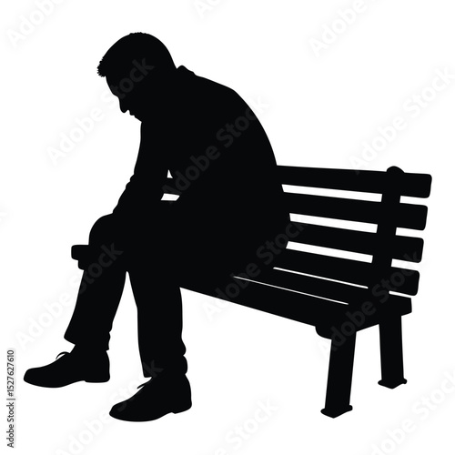 Silhouette of a Man Sitting Sadly on a Park Bench Alone