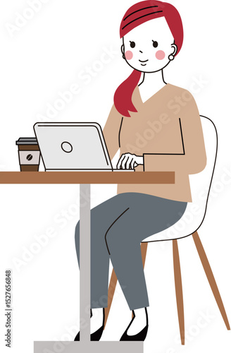 カフェテーブルでパソコンを開いて仕事をしている女性
