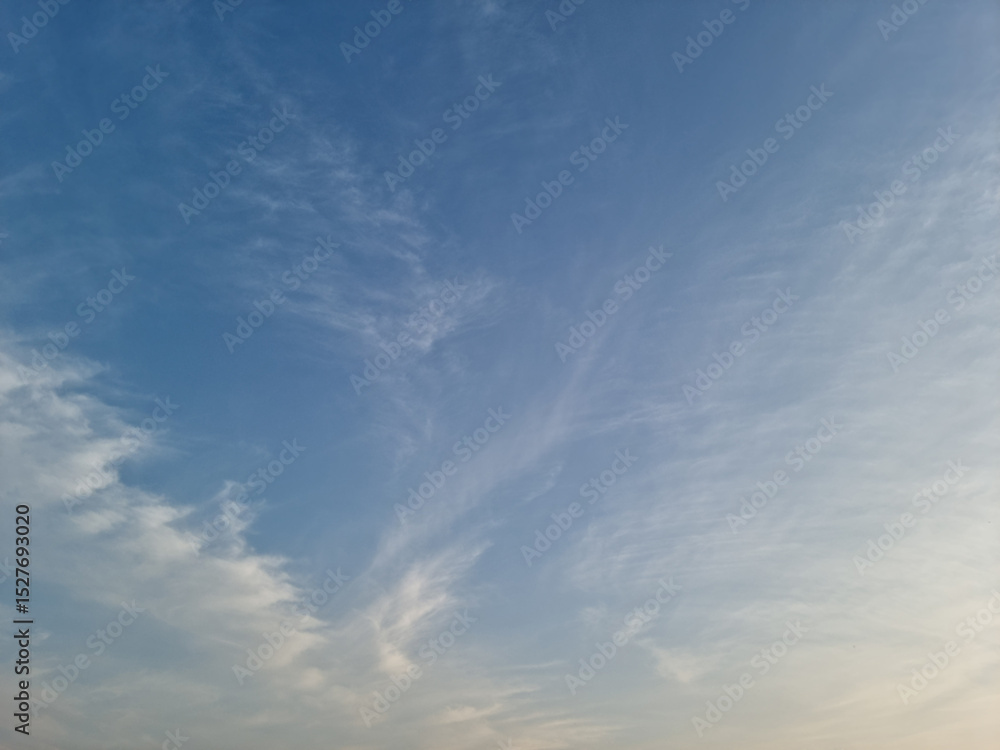 It's a sunset sky with fluffy clouds. It's a sunset sky with fluffy clouds.