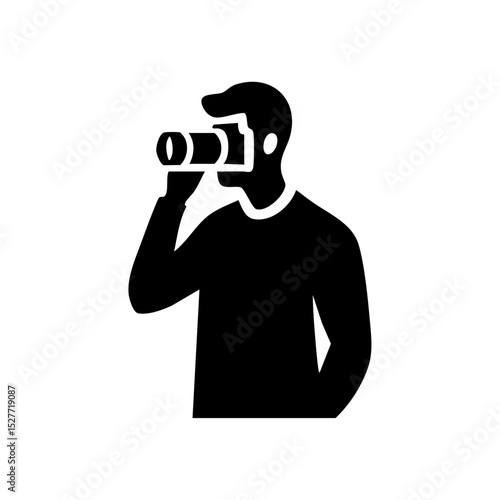 Vector icon of a photographer silhouette holding a camera, ideal for content creation and media.

