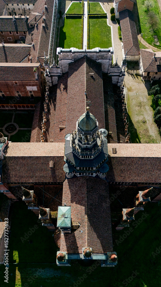 Obraz premium Aerial view of the Certosa di Pavia, built in the late fourteenth century, courts and the cloister of the monastery and shrine in the province of Pavia, Lombardia, Italy