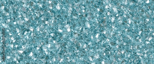 A shimmering surface of teal glitter, reflecting light with a sparkling, textured appearance, creating a vibrant and eye-catching visual.