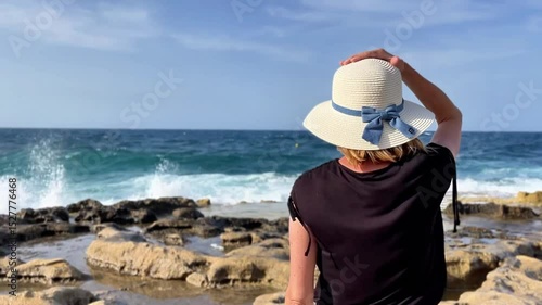 Contemplative Woman Admiring the Mediterranean Sea from Sliema, Malta