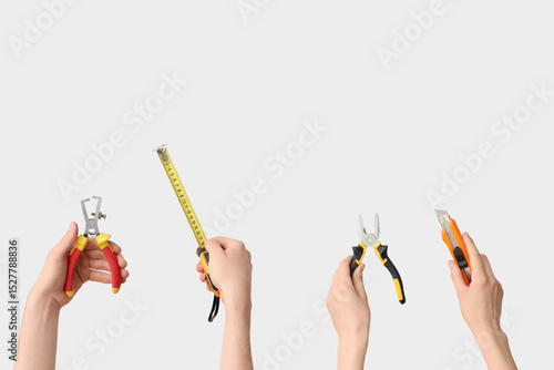 Hands holding construction ...