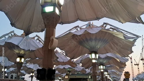 Automatic sun shade umbrellas of Medina Haram Piazza in the morning