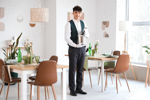 Male waiter with champagne ...