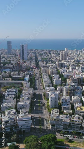 Wallpaper Mural Vertical video pull back reveal the Kikar (square ) Hamedina impressive project construction - Tel Aviv beaches in the background Torontodigital.ca