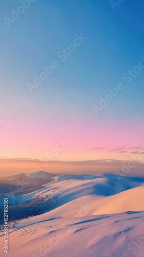 Beautiful panoramic view of the winter landscape at sunset, with snow-covered hills and a clear blue sky